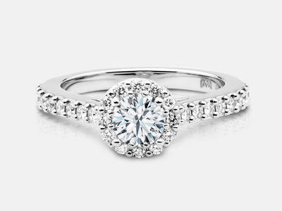 The Robyn style engagement ring set with 28 round brilliant cut side diamonds features a 0.30 carat GIA certified round brilliant center, I color, SI1 clarity.  $3320.00