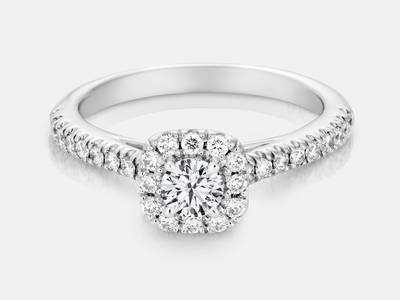 Pippa style engagement ring featuring a cushion shaped halo frame and 0.39 carats of round brilliant diamonds.  Center stone sold separate $2125.00  