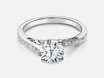 Petra style engagement ring set with 18 diamonds totaling 0.18 carats.  Center stone sold separate.  $1450.00