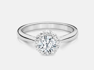 The Esmie style engagement ring set with 28 round brilliant cut side diamonds features a 0.30 carat GIA certified round brilliant center, I color, SI1 clarity.  $3100.00